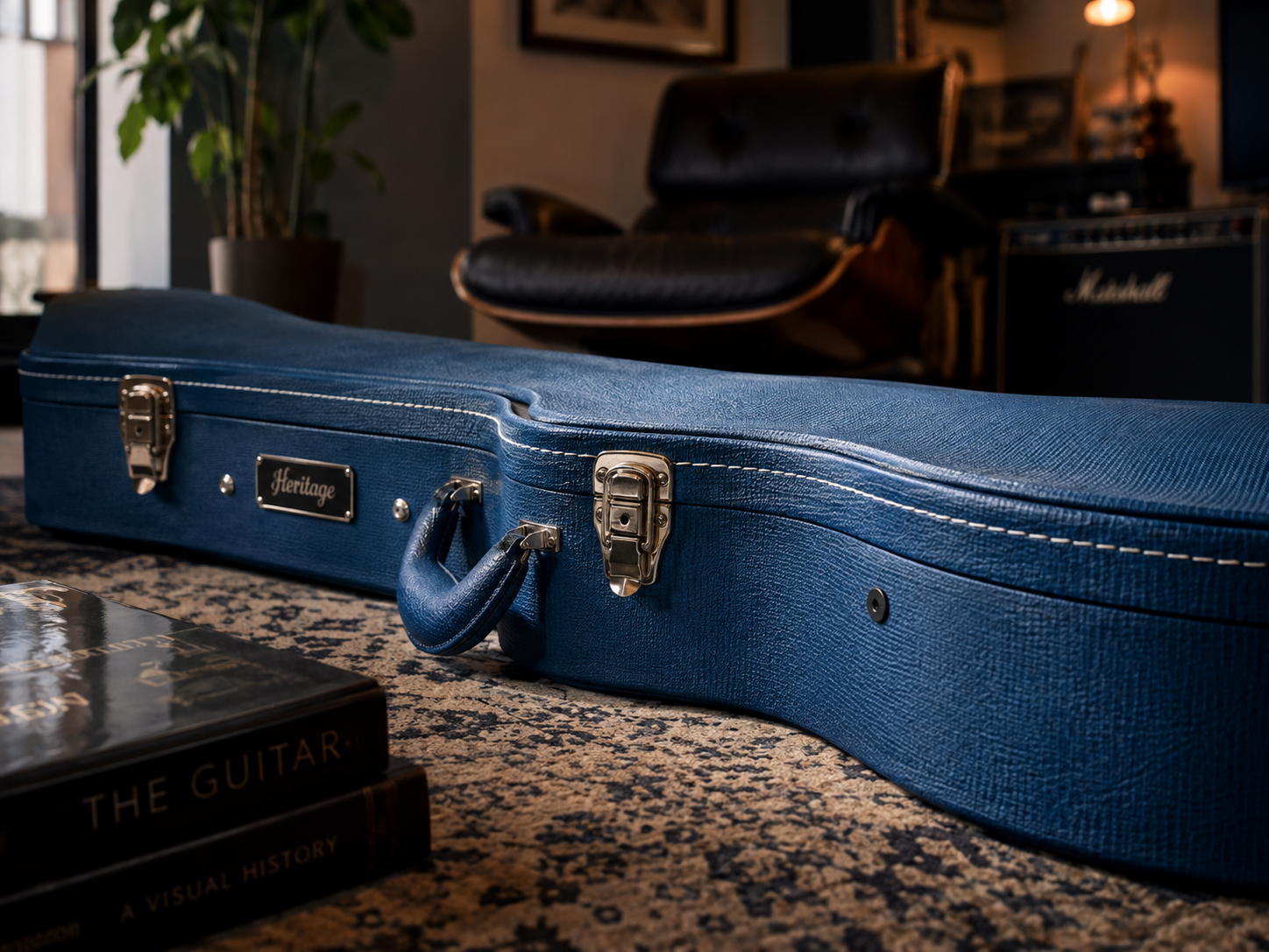 Blue guitar case protected with a black Memora Pin