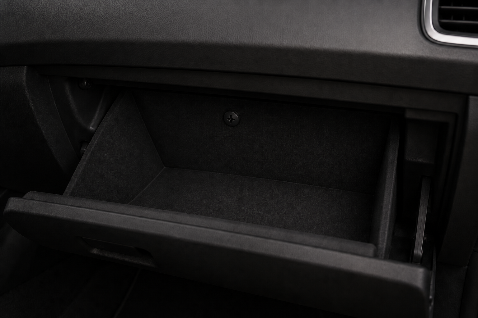 Black Memora screw Pin inside SUV glovebox